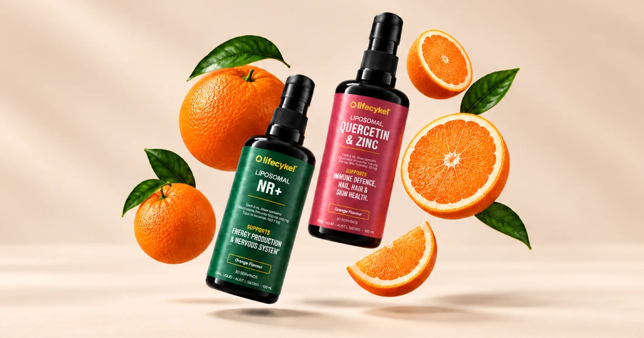Liposomal NR+ and Liposomal Quercetin & Zinc bottles floating among fresh oranges